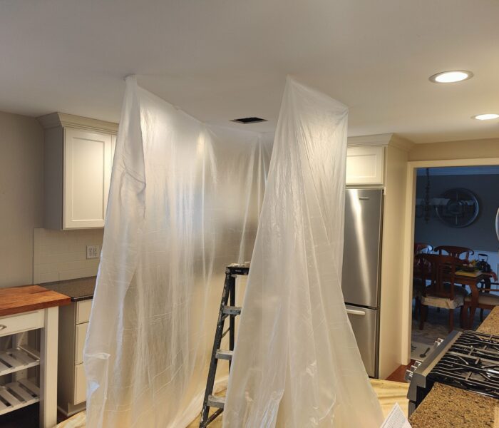 Hole in drywall ceiling in kitchen