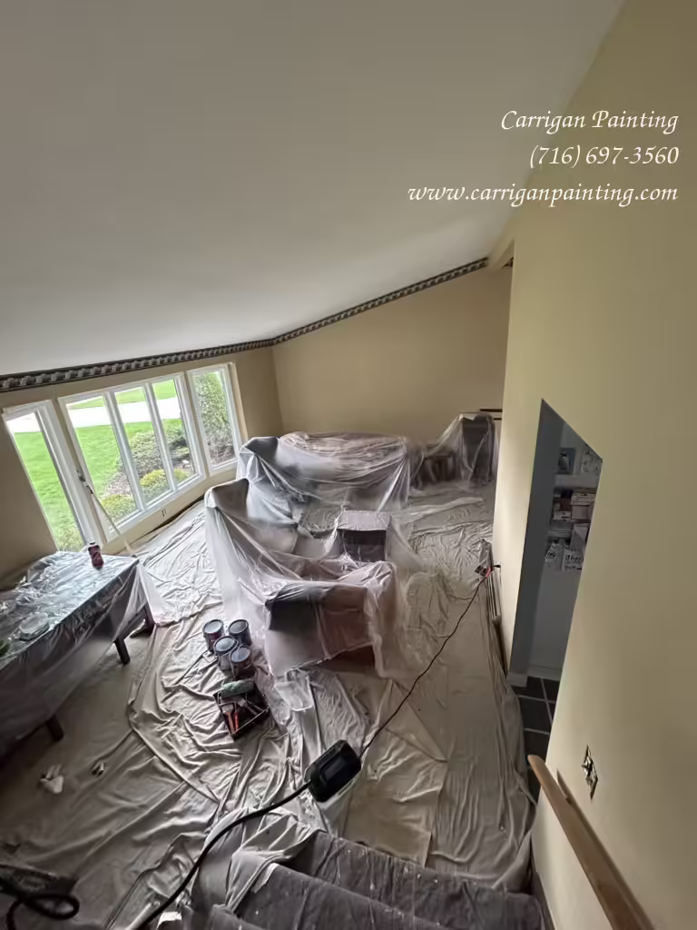 living room before wallpaper removal and painting