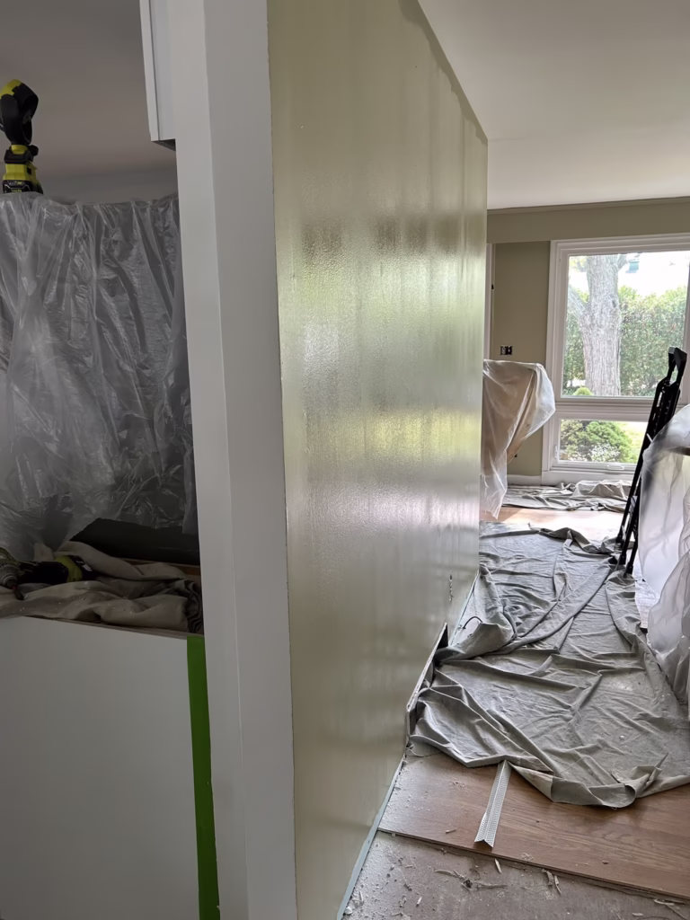 Drywall Restoration and Painting in Green Acres, Tonawanda, NY 24 Wet Paint on wall detailing skilled patchwork of underlying substrate