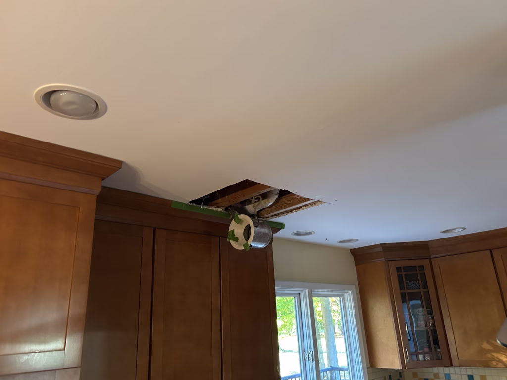 East Amherst Drywall Repair and Painting 4 Hole cut in ceiling around recessed light in Roxbury Park East Amherst 14051