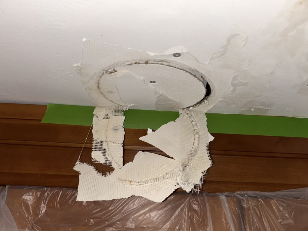 East Amherst Drywall Repair and Painting 3 During: water damage around kitchen recessed light in Roxbury Park East Amherst 14051