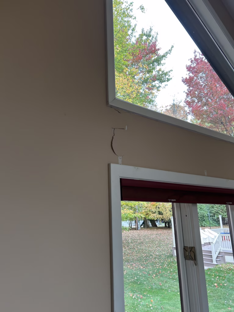 East Amherst Drywall Repair and Painting 8 water damaged paint under window in living room in Roxbury Park East Amherst 14051