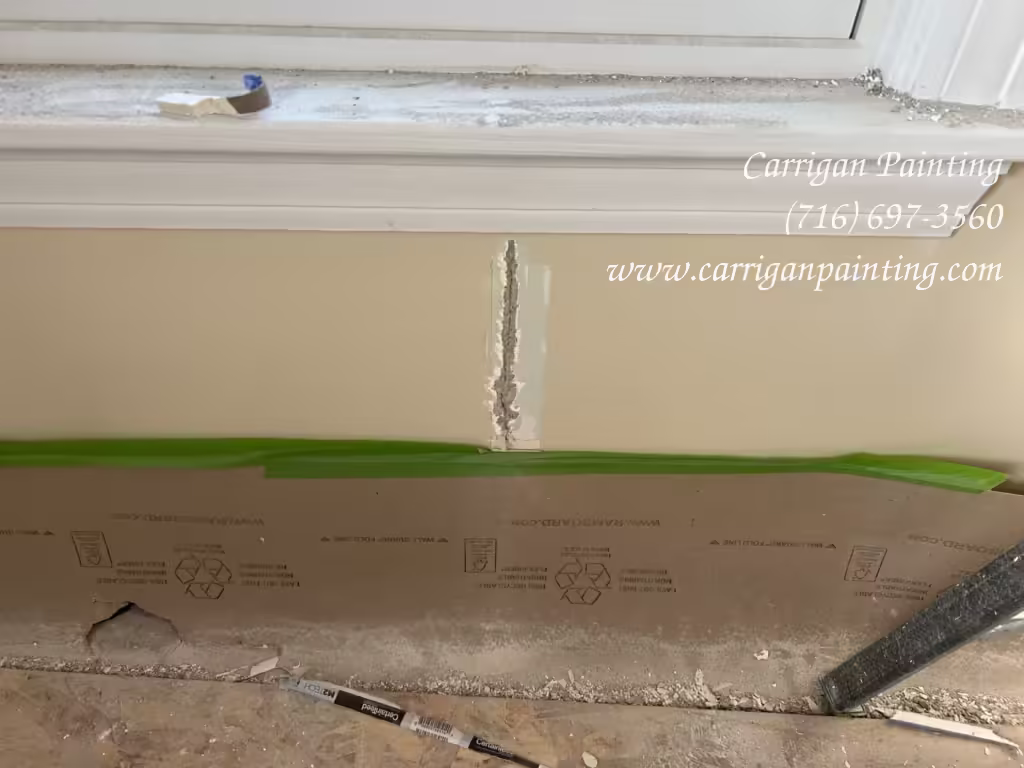 Wall crack under a window in Snyder NY 14226