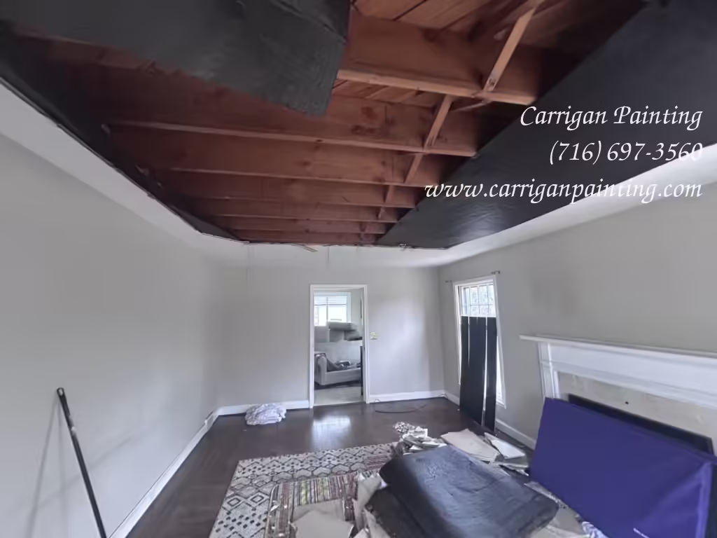 Rocklath plaster ceiling collapse in a living room with tar paper above the ceiling