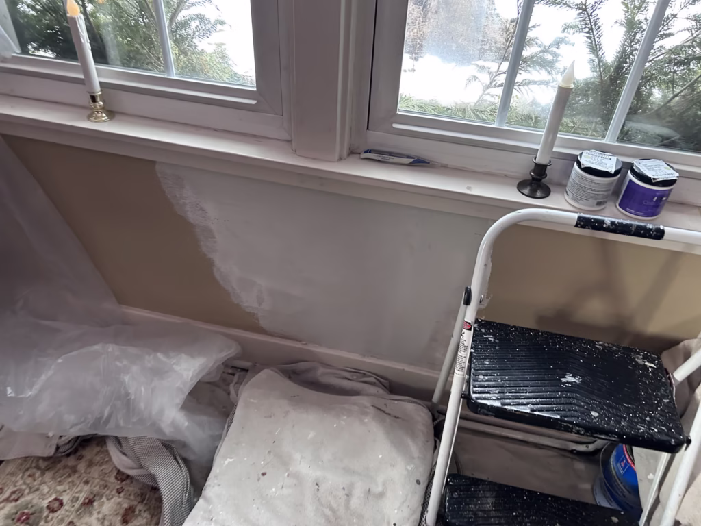 Getzville NY: Ceiling Restoration and Painting - The Carrigan Archives water damaged plaster under window repaired