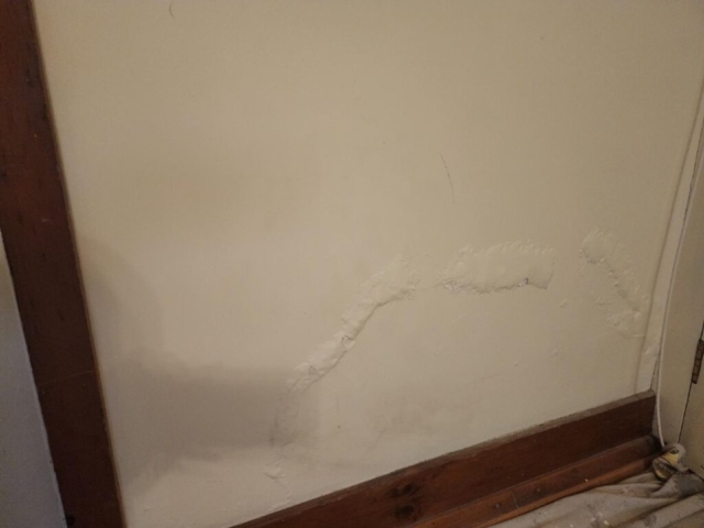 water damaged plaster wall