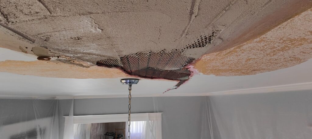Even a 125 Year Old Plaster Ceiling can be Beautiful 9 Applying plaster basecoat to ceiling patch