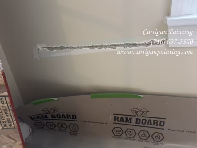 Opening plaster wall crack for proper repair in Snyder NY 14226