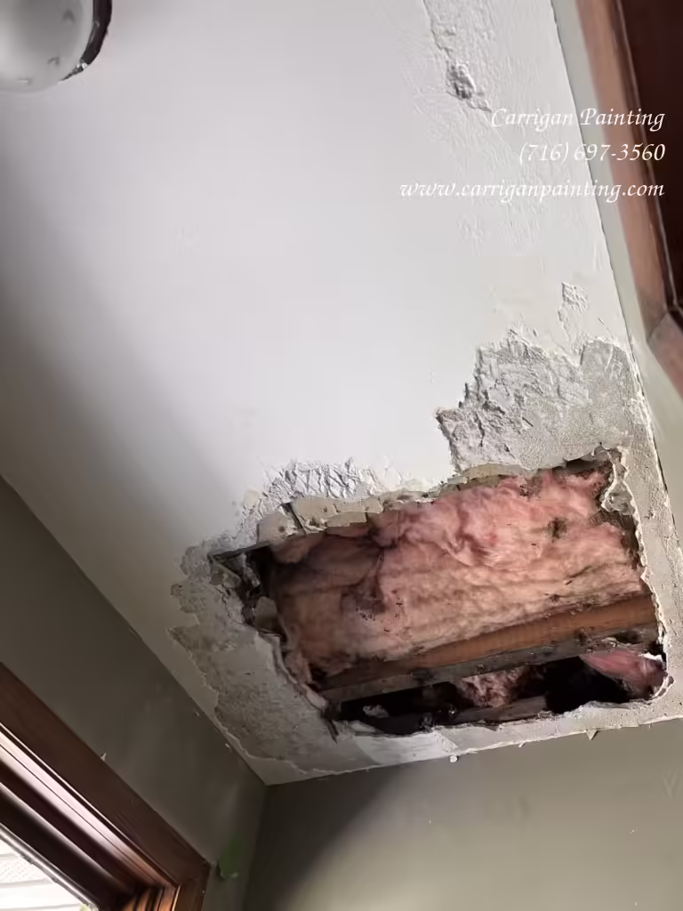 water damage plaster ceiling repair in progress, caused by a roof leak in Tonawanda NY