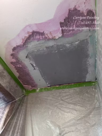 water damage plaster ceiling repair in progress, caused by a roof leak in Tonawanda NY