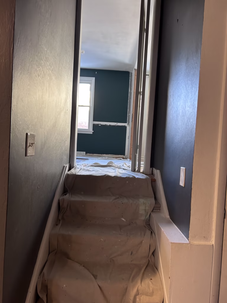 Williamsville, NY 14221, hallway walls prior to removal of paintable wallpaper