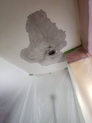 water damage to plaster ceiling. Removed plaster finish coat which was damaged by water.