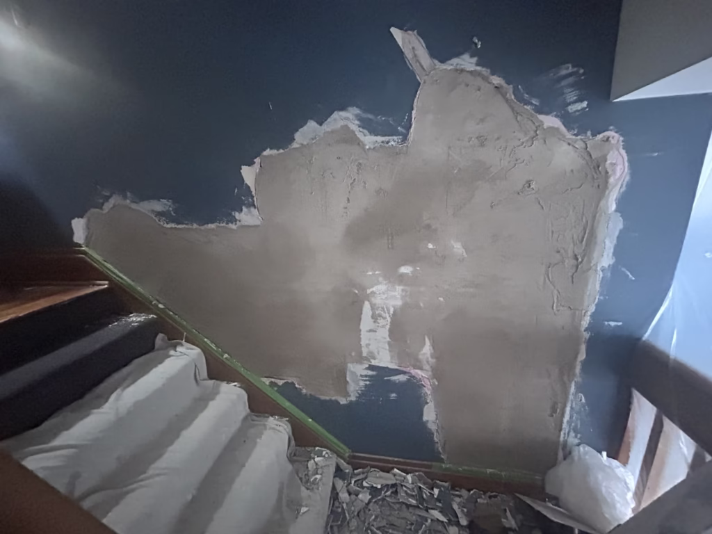 scratch coat and  Brown coat applied to large wall patch