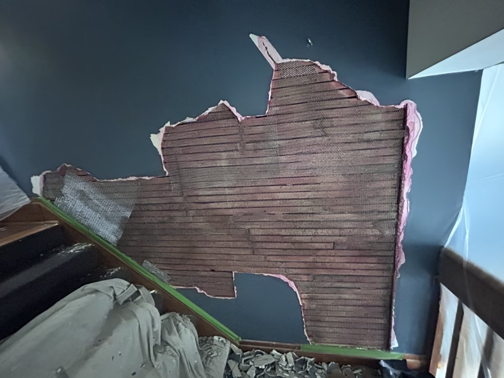 metal lath installed over wood lath in plaster wall