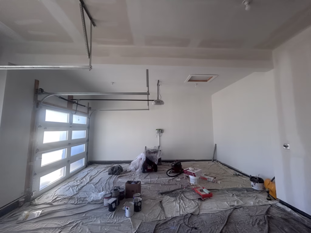 Applying PVS drywall primer to bare drywall in a 3 car garage in Clarence NY