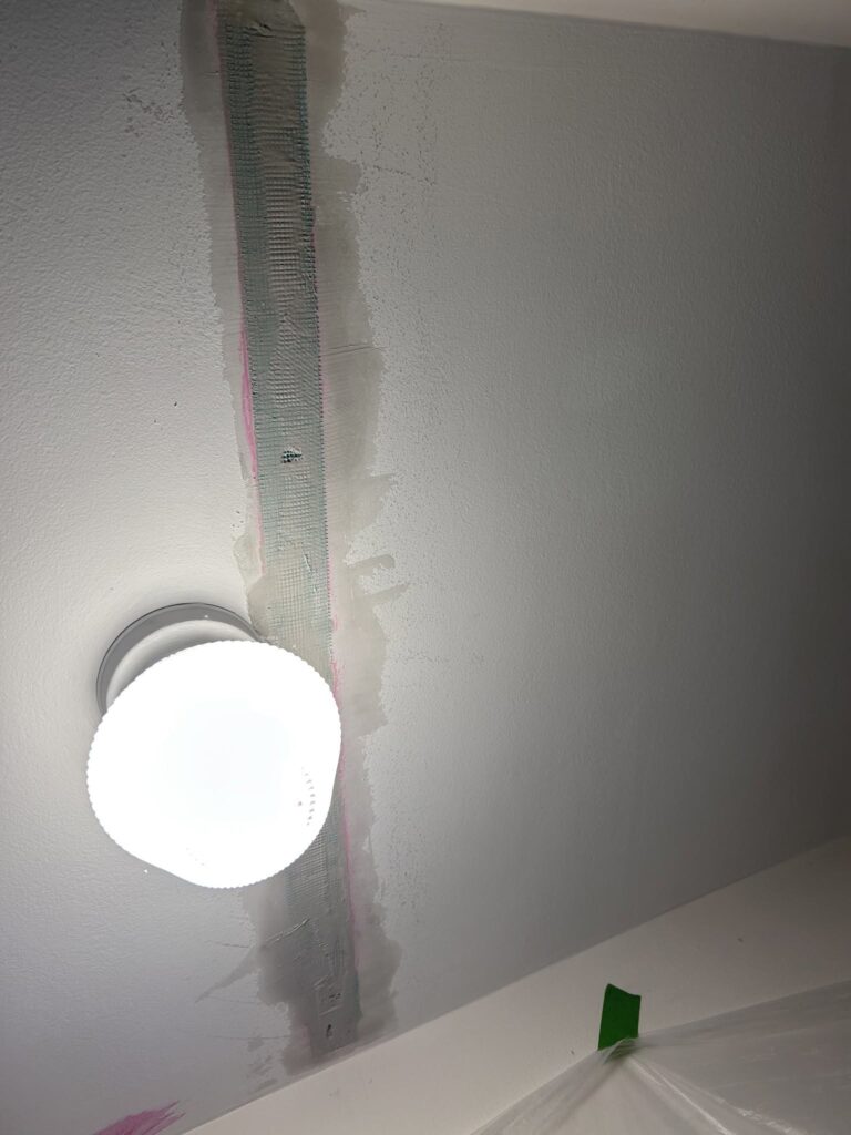 plaster crack backfilled with durabond, reinforced with fiberglass mesh tape